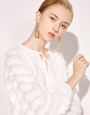 White fringed sweater with...